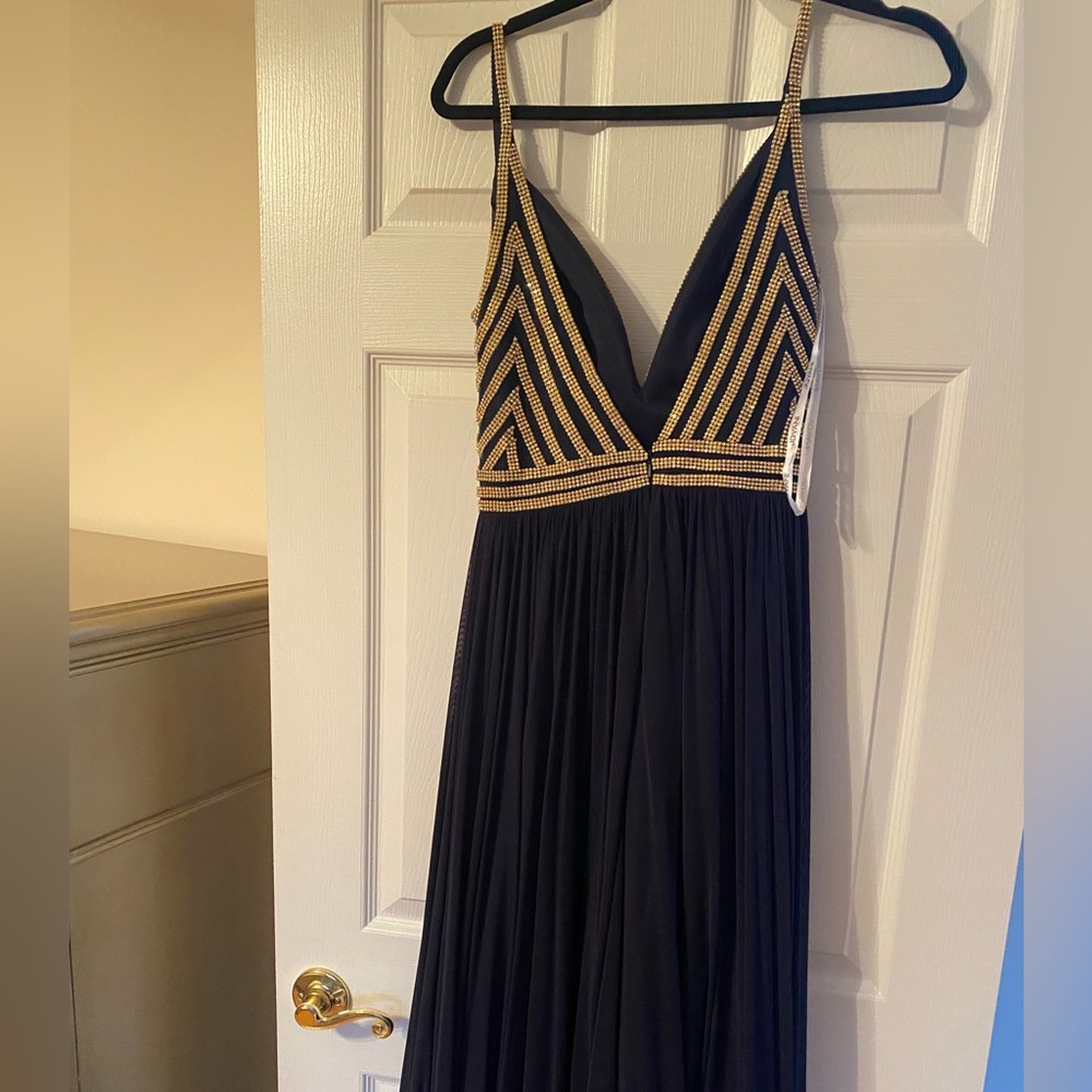 Brand new prom dress by Jovani- tag still on! Dress is navy blue